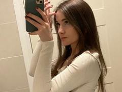 Dionisia - female with brown hair and  small tits webcam at xLoveCam