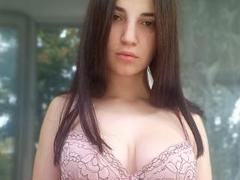 DorisRed - female with black hair and  small tits webcam at ImLive