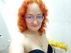 LoversBirdX - female with red hair and  small tits webcam at xLoveCam