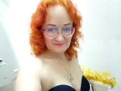 LoversBirdX - female with red hair and  small tits webcam at xLoveCam