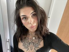 NovaSin - female with brown hair and  small tits webcam at xLoveCam